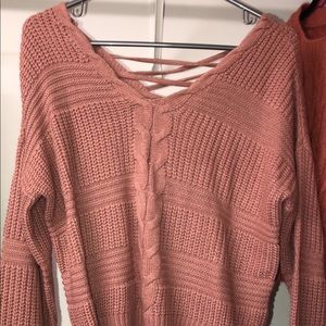 Size Medium Pink sweater with a super cute back! Never worn!